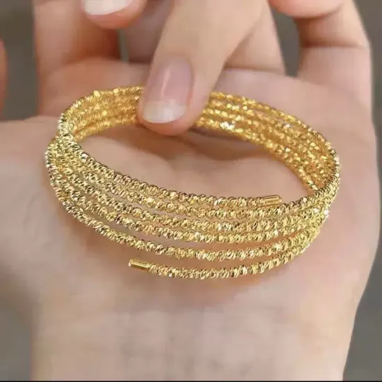 Picture of The gold bracelet has a multi-layered bracelet showing white femininity